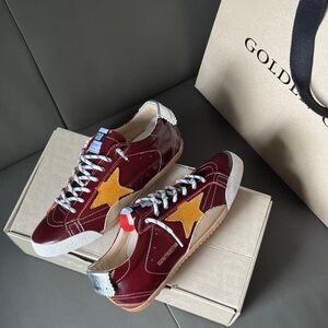 Golden Goose Women's Burgundy Sneakers with Yellow Star